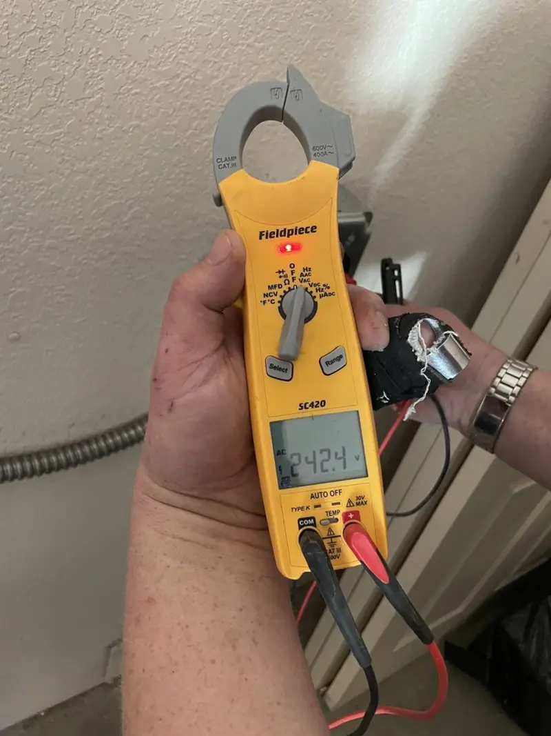 Voltage testing with clamp meter during Recessed Lighting Installation in Plainfield